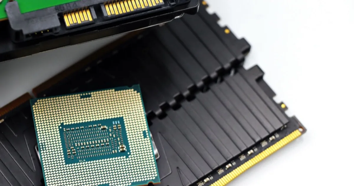A computer processor and memory modules on a work surface.
